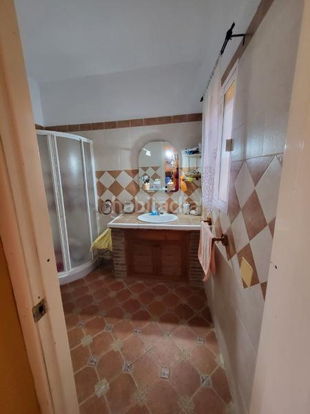 Foto 74a1286c-d05b-4692-9cc1-852011a7d059. Casa aparellada amb xemeneia calefacció aparcament piscina a Medina Sidonia