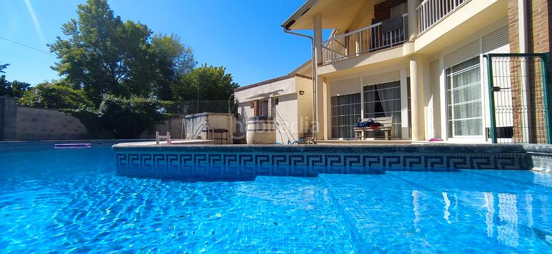 Foto 1d12e4a5-1ac8-4f2e-a422-5ec822c6d8cd. Casa aparellada amb calefacció aparcament piscina a Santa Cruz de Bezana