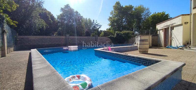 Foto f231c409-1a96-49e7-aeab-598c5c779b9d. Casa aparellada amb calefacció aparcament piscina a Santa Cruz de Bezana