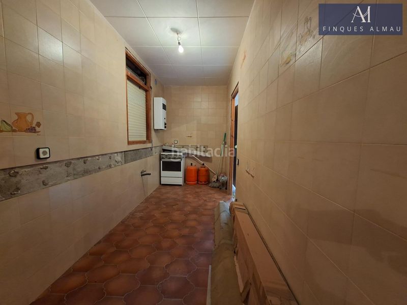Foto 82e5cd2b-f546-4362-9611-99ed056c6688. Casa aparellada amb aparcament a Olivella