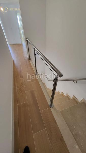 Foto 575dc3ff-c987-4a4c-8879-510cc3d90acc. Casa adossada amb piscina a Centro Tomares