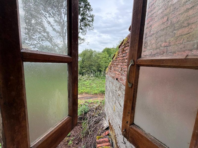 Foto ce50a3e1-a7ef-448d-8842-2c2983f611b4. Casa aparellada amb xemeneia a Cartelle