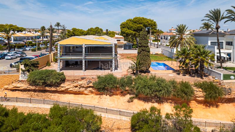 Foto 51a3fb28-c2e8-4883-b8fb-5a2146f1ad1c. Chalet with parking pool in Cabo Roig Orihuela