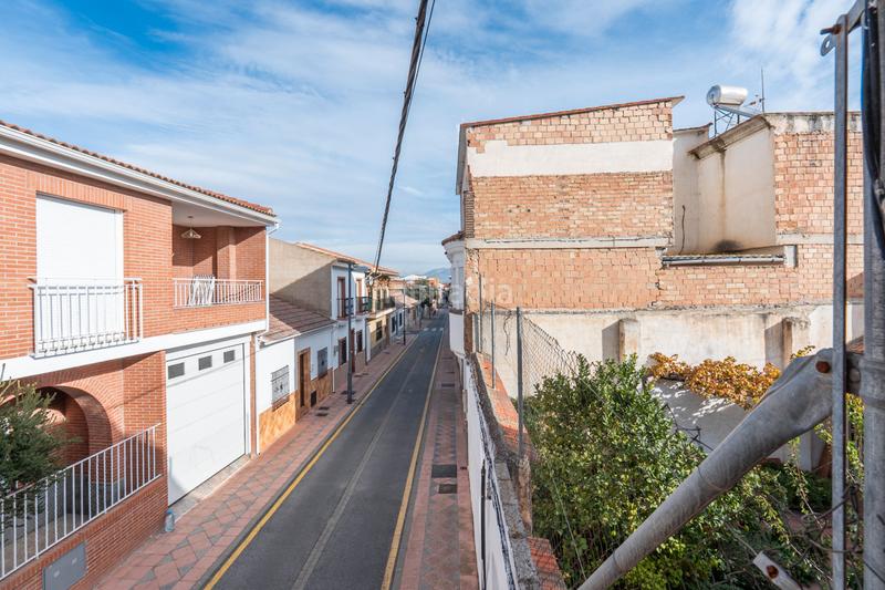 Foto f939fbdc-a3d3-4865-abfc-4ff2a282373b. Casa a schiera con camino in Avda. De los Ogíjares Armilla