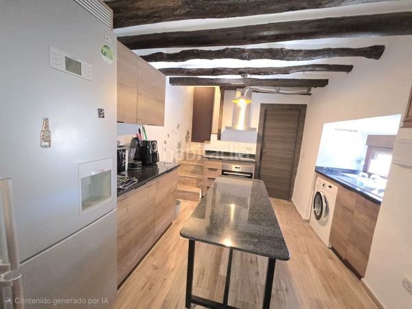 Foto bced11be-2549-43fa-bb7d-becee79c4a4b. Casa adosada en Laroya