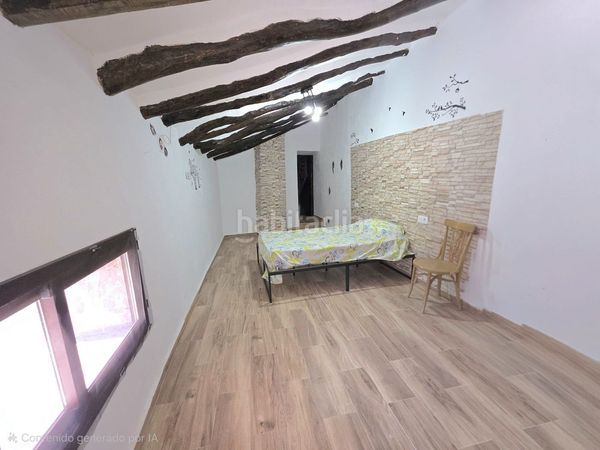 Foto f2128821-586d-4497-b191-e9d1bf99980a. Casa adossada amb xemeneia a Laroya