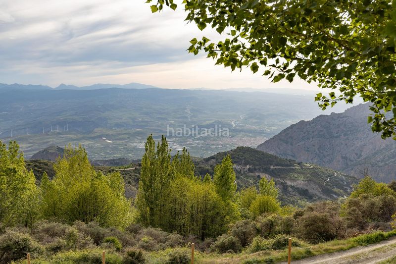 Foto e1da3ecc-1f76-4229-8a77-14df449111f5. Masia amb xemeneia a Nigüelas