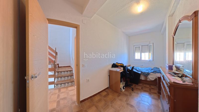 Foto 918eee2d-5ade-46ac-9d4f-6c11837186df. Casa aparellada amb xemeneia calefacció aparcament a Sueca
