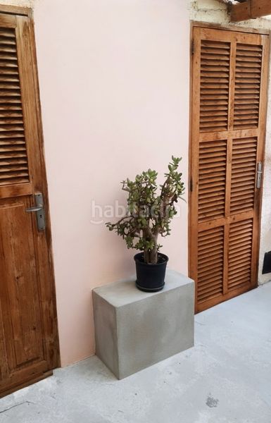 Foto db2a6f45-03f3-426a-bf79-fa2a55774f24. Casa amb xemeneia aparcament a Manacor centre Manacor