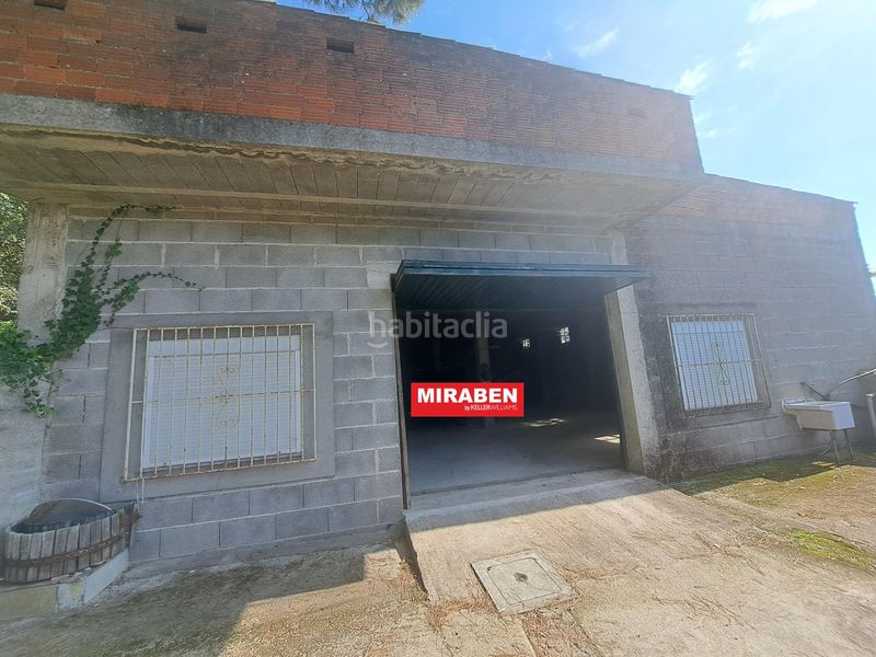 Foto 2065e10b-ccc8-481c-8e9b-32f82fca06a2. Casa amb aparcament a Rianxo