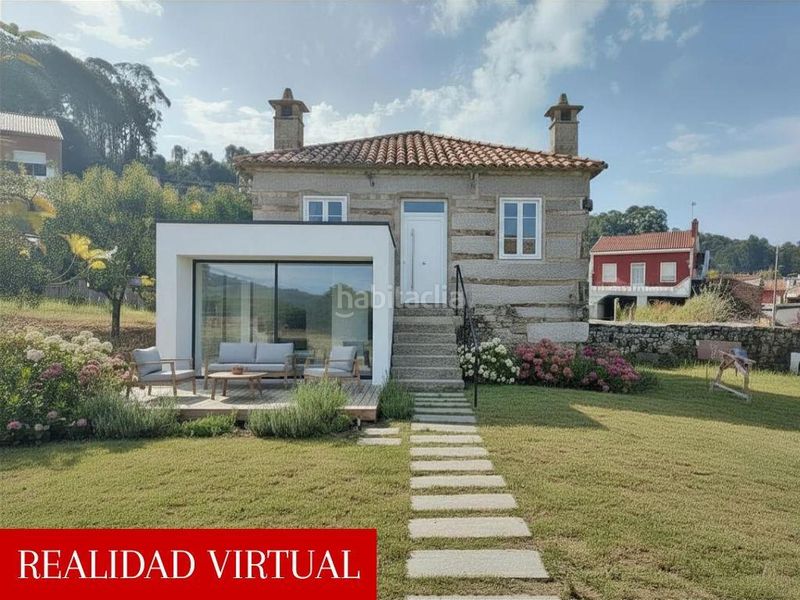 Foto a3bfbd4f-013e-4c7f-be53-e6f7d14eb749. Casa amb aparcament a Cea Vilagarcía de Arousa