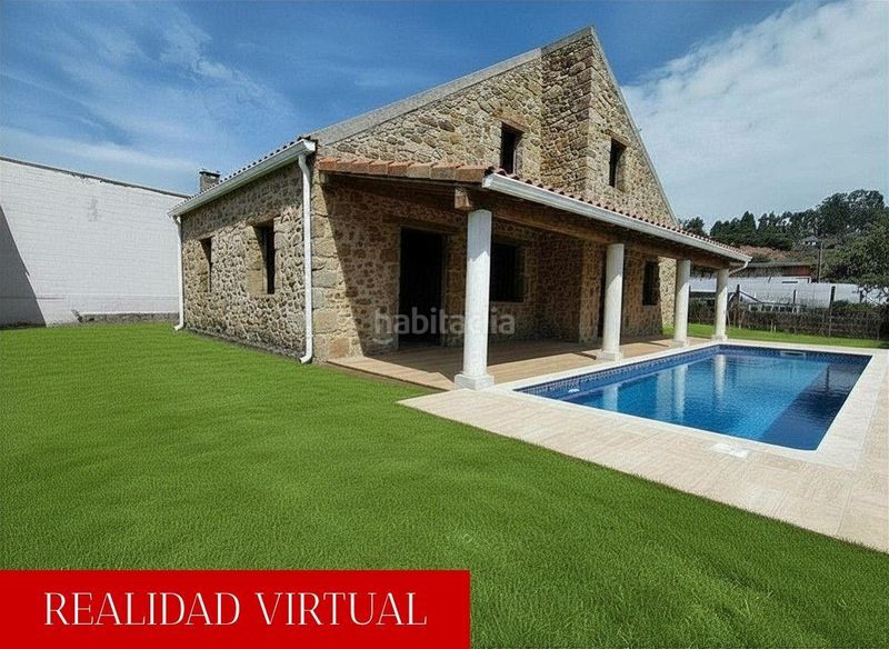 Foto 98204e67-c5e2-445f-8937-ce589fa1ce18. Casa amb aparcament a Catoira