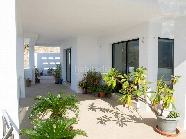 Foto 900e4c9b-5733-4879-a2ef-9a7e1d13b9ba. Casa amb aparcament a Las Flores Mijas