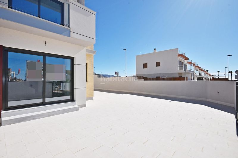 Foto b9709bfe-8772-4eec-ac53-01a040a1a2c4. Casa pareada modernas villas adosadas con vistas al mar en puerto en Mazarrón