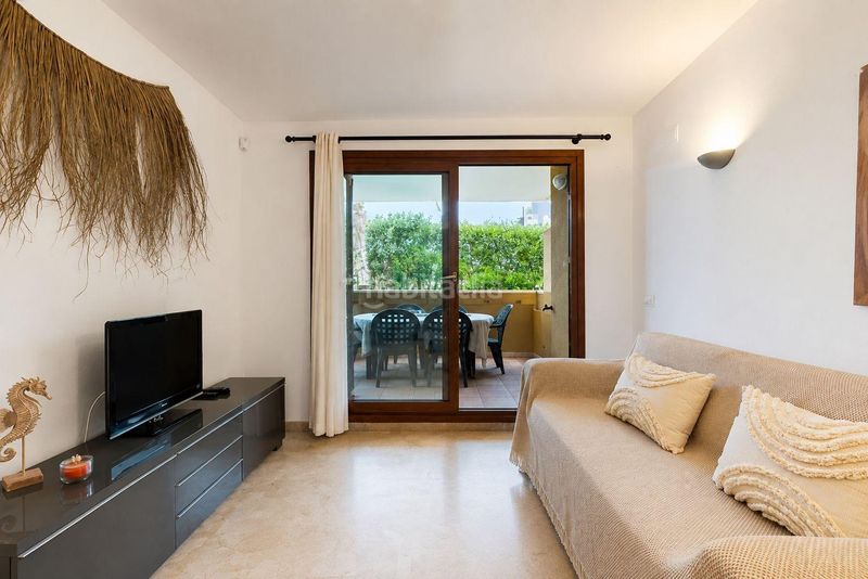 Foto 25d25cd1-497a-41a7-b138-5c8ee752ccce. Apartament amb aparcament a Punta Prima Torrevieja