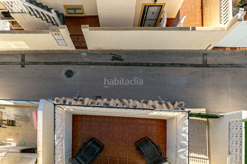 Foto db3cb8f2-6dcf-46ba-a59c-17dc62a309e0. Casa amb aparcament a Playa Flamenca Orihuela