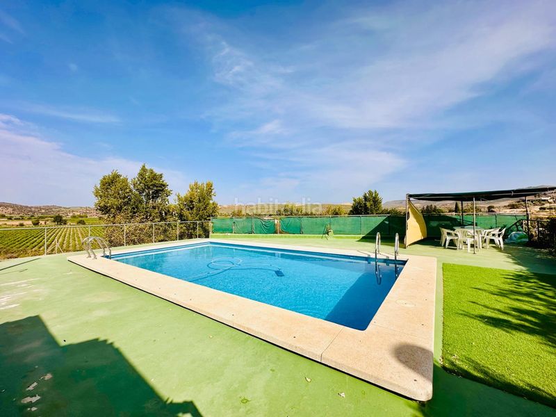 Foto 539645cf-d0d8-49b6-917f-f10ce338cc79. Masia amb piscina a Loja
