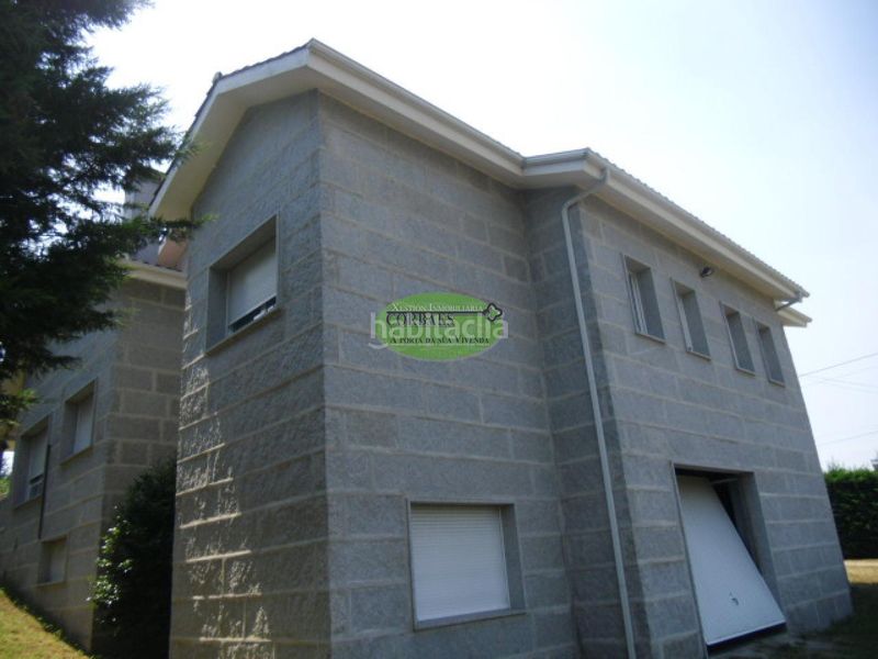 Foto 19130fe9-0e3a-4519-90d1-ff5975cfd82c. Casa amb calefacció aparcament a As Lagoas Ourense