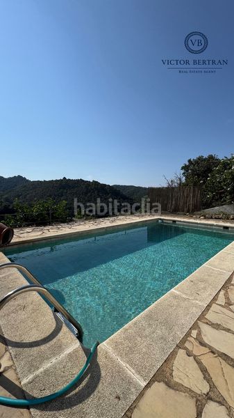 Foto c8f08cf1-b1eb-4a08-9f86-a98bf54456e1. Casa adossada amb xemeneia calefacció aparcament piscina a Sant Cebrià de Vallalta