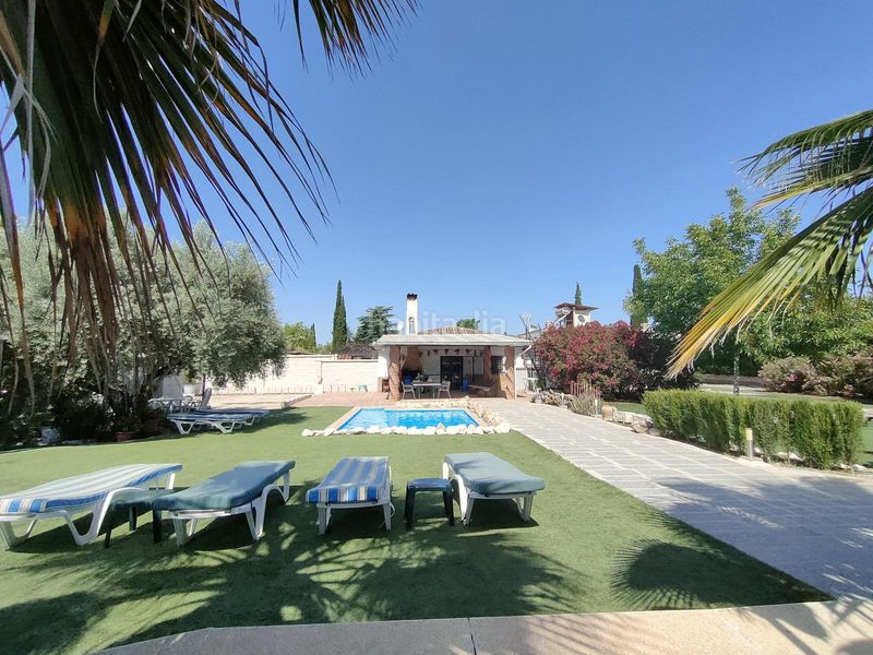 Foto a9e0218d-e5b9-48b3-a1d0-24a9d0576ead. Masia amb xemeneia calefacció aparcament piscina a Atarfe