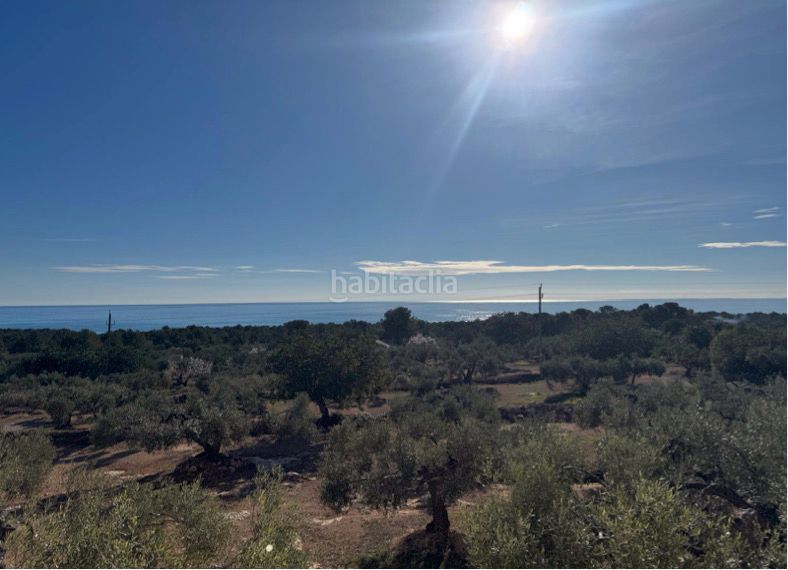 Foto bae5b6be-f9f6-419a-8625-c0a553a67861. Masia amb xemeneia aparcament a L´Ametlla de Mar Ametlla de Mar (L´)