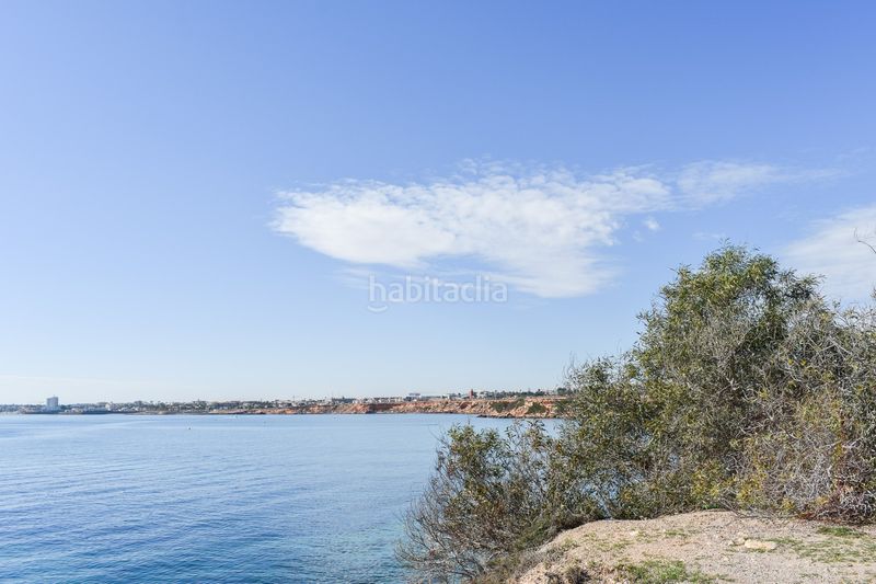 Foto 16a618b0-42be-46ed-a5c4-c45d24928414. Casa en Punta Prima Orihuela