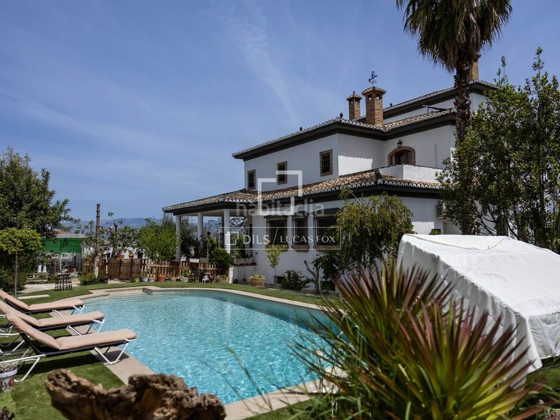 Foto 90a0b865-d98f-4d63-873a-7b8474d26f28. Chalet exclusiva villa de estilo andaluz con vistas panorámicas a la ciudad de granada y sierra nevada en venta en ogijares en Ogíjares
