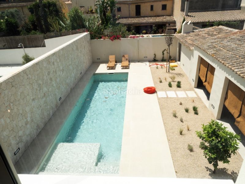 Foto 759f5ad6-d0b4-4c71-af83-a6d48c271af1. Casa aparellada amb aparcament piscina a Ses Salines poble Ses Salines