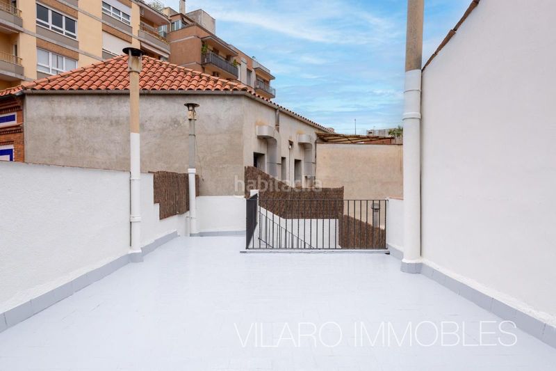 Foto bf0e9619-d012-45ae-95ea-78bbffba5342. Casa adossada amb xemeneia calefacció aparcament a Terrassa