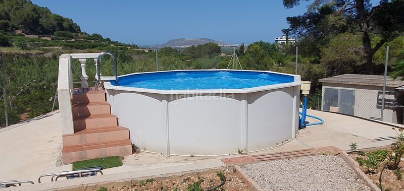 Foto 2b08aa5e-a25d-478e-a98f-82f49222f359. Masia amb xemeneia calefacció aparcament piscina a Llaurí