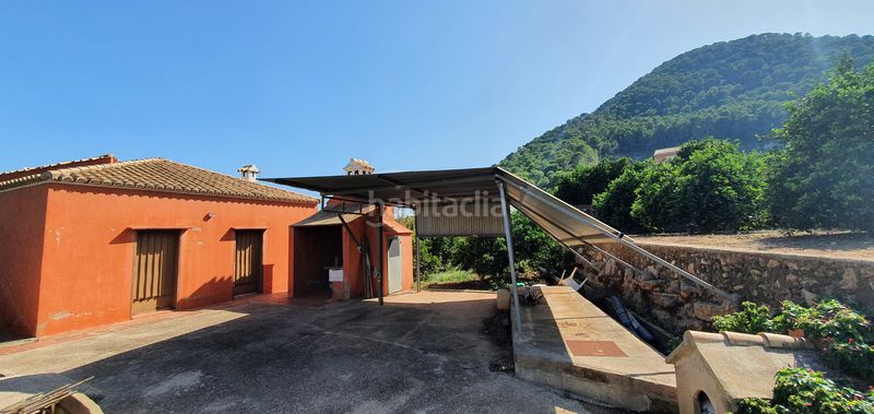 Foto a7159125-dad3-4ba3-bf0b-46a68a4894ce. Masia amb xemeneia calefacció aparcament piscina a Tavernes de la Valldigna