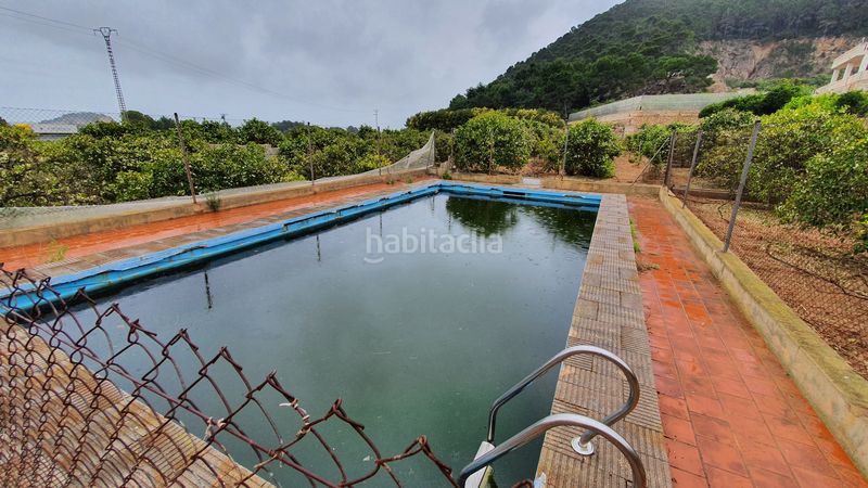 Foto cee64c0d-983b-48d1-87a0-d8d04780c546. Masia amb xemeneia calefacció aparcament piscina a Tavernes de la Valldigna
