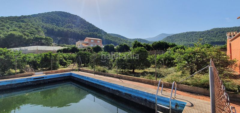Foto d9b8d56b-b79e-487c-aac1-99c151f777ef. Masia amb xemeneia calefacció aparcament piscina a Tavernes de la Valldigna