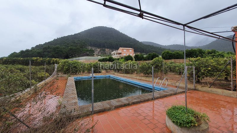 Foto face82e3-8f71-4585-b38a-50ad0ae1ef52. Masia amb xemeneia calefacció aparcament piscina a Tavernes de la Valldigna