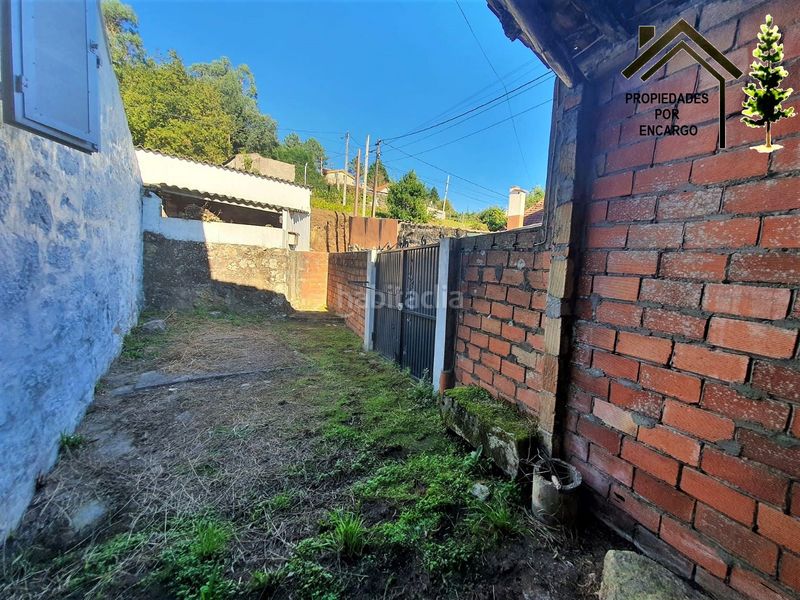 Foto a6e0c3bd-13d6-416b-8247-6064e8728c77. Casa amb aparcament a Coiro Cangas