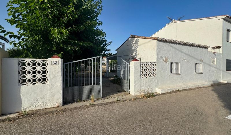 Foto 6d0c67e3-b00a-4d96-ba1c-eaadf646cee2. Casa aparellada amb aparcament a Oliva nova Oliva
