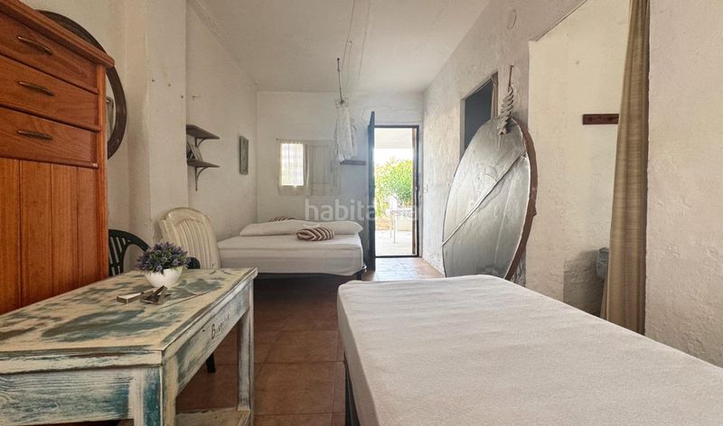 Foto c8243170-6201-44d0-b56c-1426844363c0. Casa aparellada amb aparcament a Oliva nova Oliva