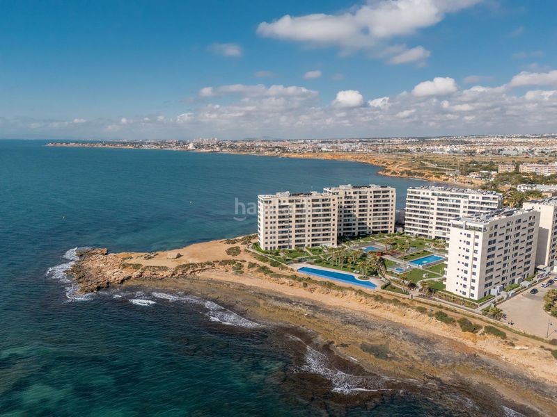 Foto 40a472d3-6040-4d39-9a65-ed24367e6a15. Apartament amb aparcament piscina a Punta Prima Torrevieja