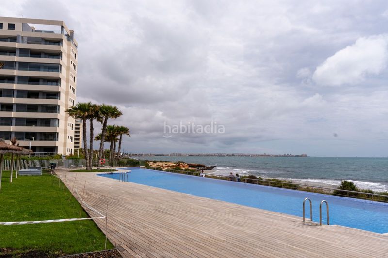 Foto 46c95962-1a48-470a-89f4-b37799dc8c80. Apartament amb aparcament piscina a Punta Prima Torrevieja