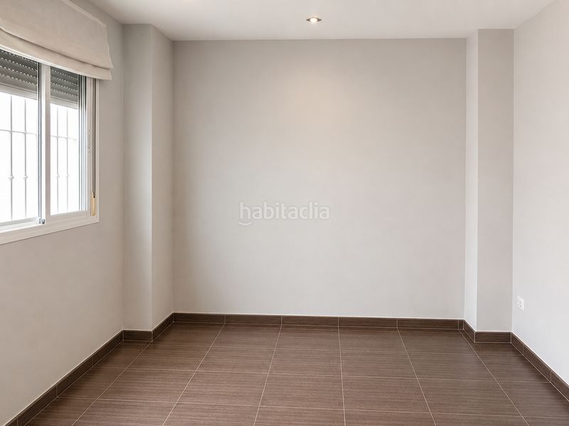 Foto 0bedd0eb-3261-4c12-b848-ffba1cc6fcc3. Casa adossada a Lora del Río