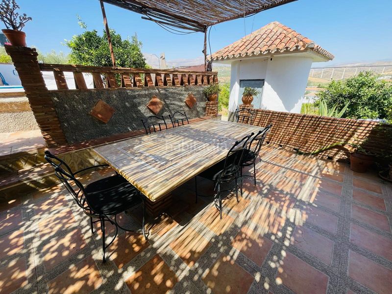 Foto 26085f7a-8fbd-4707-b4bd-378998ff8960. Masia amb xemeneia aparcament piscina a Álora