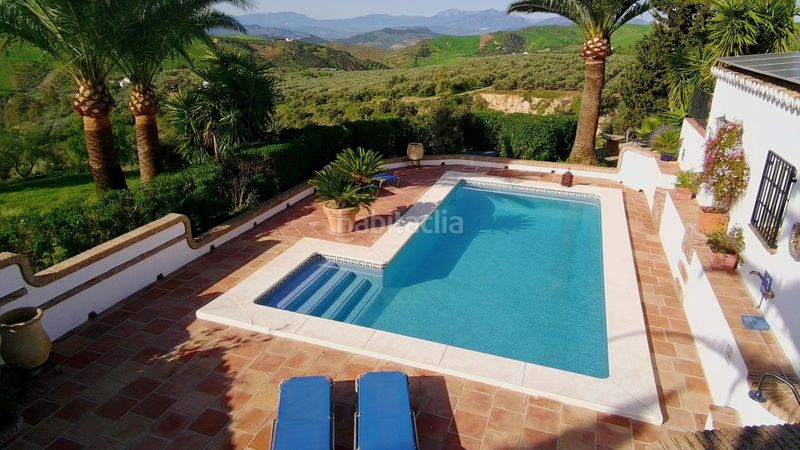 Foto 93e753dc-e64d-4fc9-9265-f03d5b272848. Masia amb xemeneia calefacció aparcament piscina a Villanueva De La Concepción