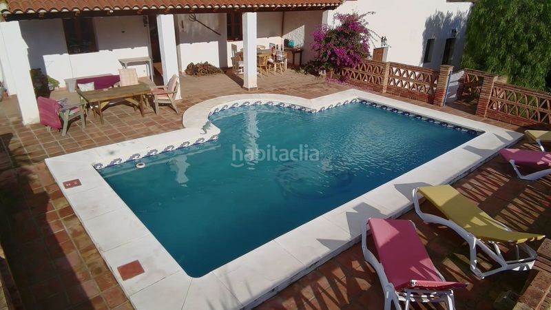 Foto ac8b82f7-0767-4c60-b6c3-39ddda3fdfaa. Masia amb xemeneia calefacció aparcament piscina a Álora
