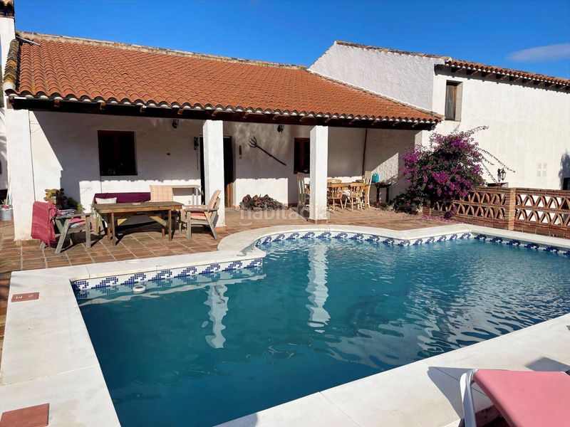 Foto d5148596-dbfd-45c3-a300-c244e8779b6b. Masia amb xemeneia calefacció aparcament piscina a Álora