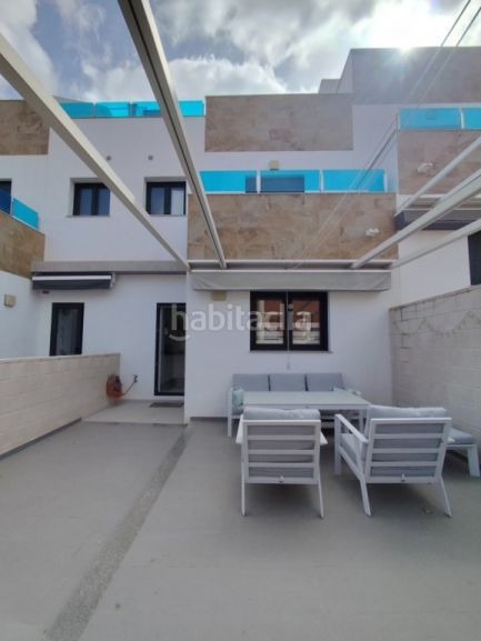Foto f615888e-4234-43de-be3c-f9d45354ed73. Casa adossada amb piscina a Bigastro