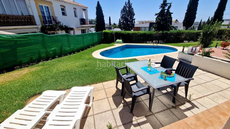 Foto 48430e74-4282-4b60-a3c0-3f8ed2fdee3e. Casa a schiera con camino piscina in Mijas golf Mijas