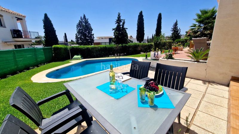 Foto d1f62e86-86f7-4867-8284-c3c0c86a562d. Casa a schiera con camino piscina in Mijas golf Mijas