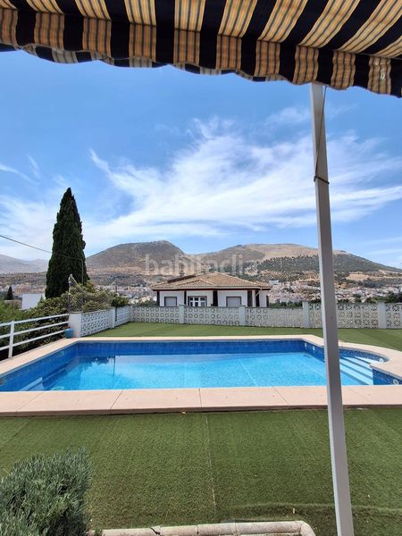 Foto 1c4fb3c2-bcd4-43c6-b8d3-5d6a9b54dd12. Casa amb xemeneia calefacció aparcament piscina a Loja
