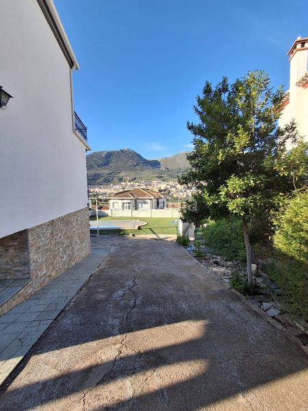 Foto 208498d6-71ca-4c64-8095-1fe890c5b1ad. Casa amb xemeneia calefacció aparcament piscina a Loja