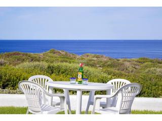 Appartement à Cala en Porter. Vivienda adosada situada en 1 línea de mar en ses tanques menorc